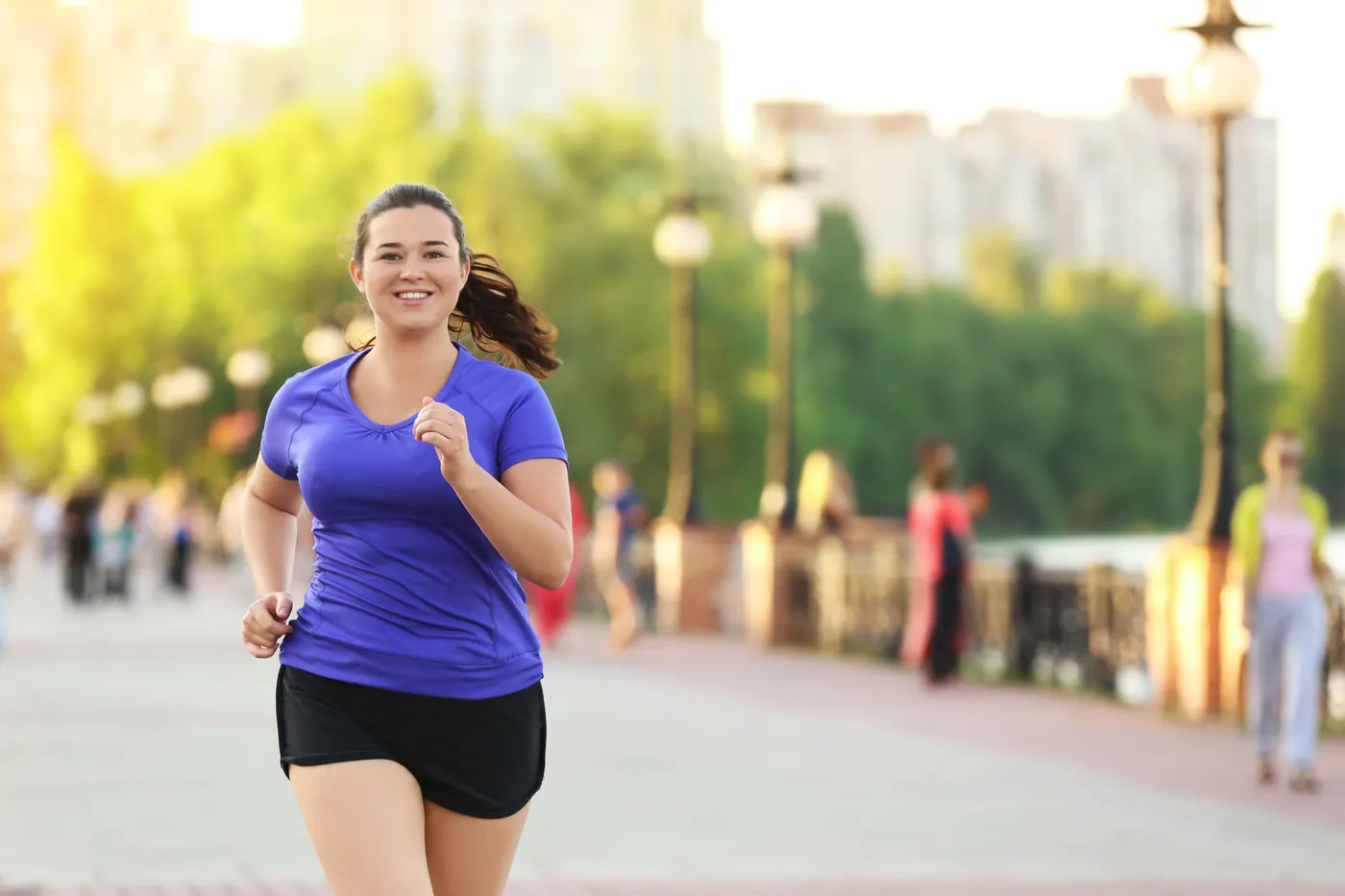 Woman running outdoors after starting a medical weight loss plan