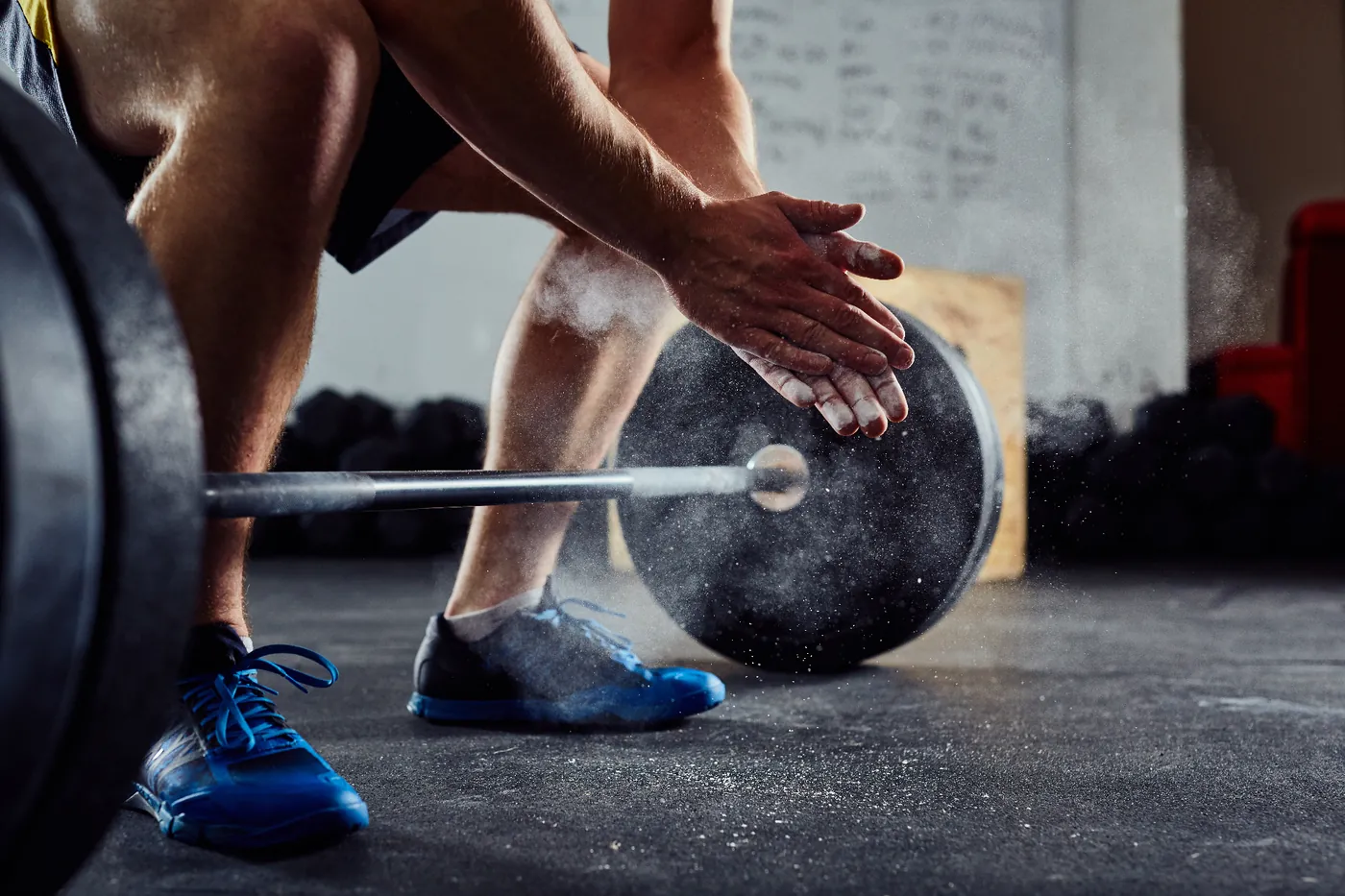 Man deadlifting after starting hormone therapy